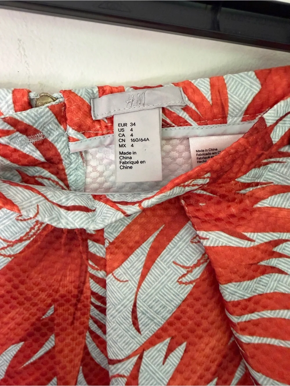 H&M White Skirt with Vibrant Orange Leaf Print